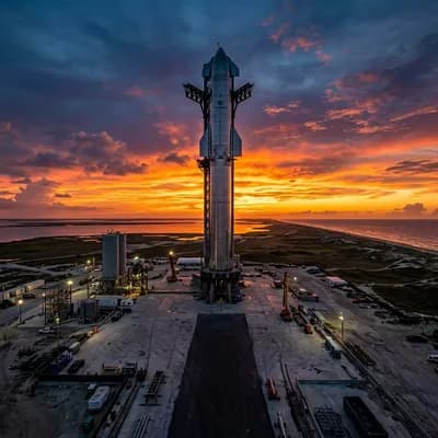 Starship rocket standing on the launchpad against a sunset